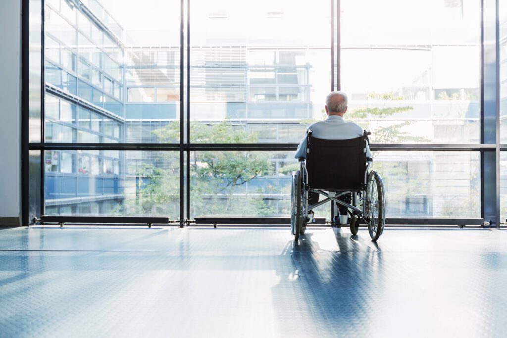 lonely elderly person in wheel chair